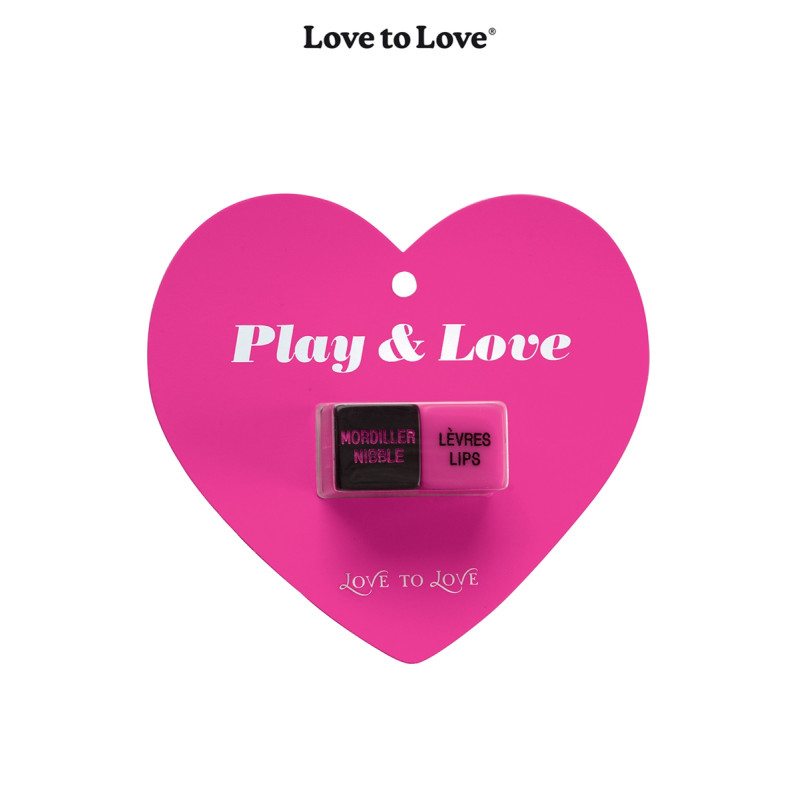 Dés coquins Play & Love en gros plan, montrant les inscriptions caresser, embrasser, seins ,bouche.
