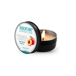 Bougie de massage pêche Amoreane, la cire se transformant en huile tiède sous la flamme.