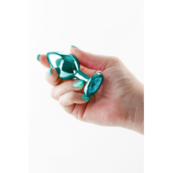 Vue de face du plug bijou anal NS Novelties, design métallique vert brillant et élégant pour usage intime.