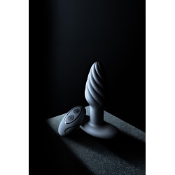 Accessoire intime anal avec stimulation rotative et vibrante, design ergonomique pour usage mixte.